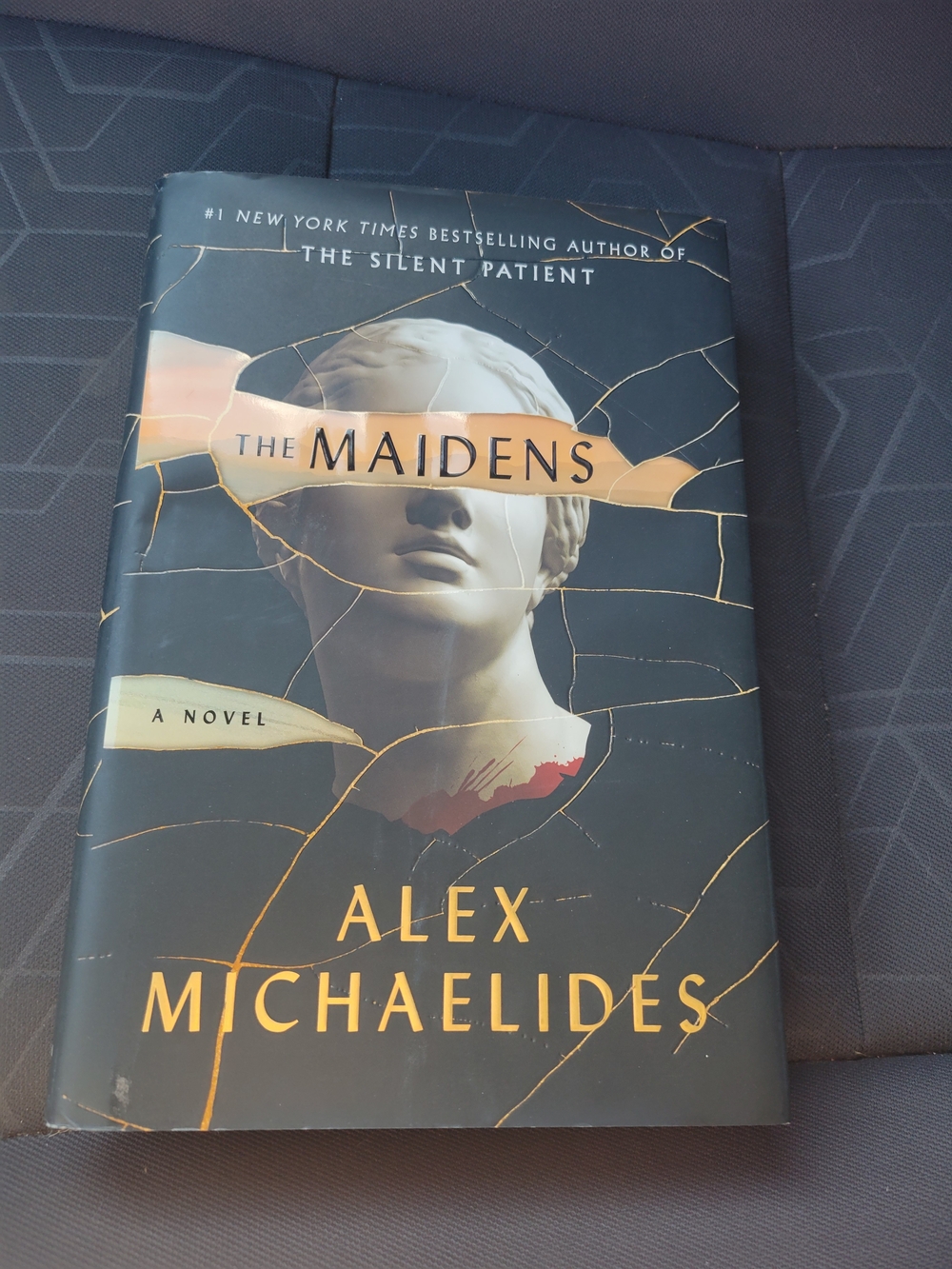 The Maidens Hard Cover Book